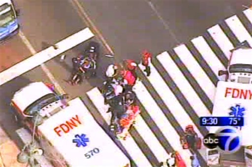 In this frame grab from WABC-TV, emergency personnel respond to reports of several people being shot outside the Empire State Building. Authorities say the shooter is dead.