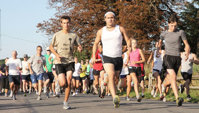 In this 2011 file photo, runners take off at the start of the Fourth Annual 5K Run for the Fallen. The event raises funds for military families who have lost a loved one, but the fifth and final one is Sunday because of feuding and a lawsuit.