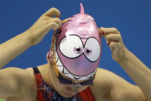 Jennet Saryyeva of Turkmenistan puts on her goggles during a practice session at the Aquatics Centre in the Olympic Park ahead of the 2012 Summer Olympics in London.