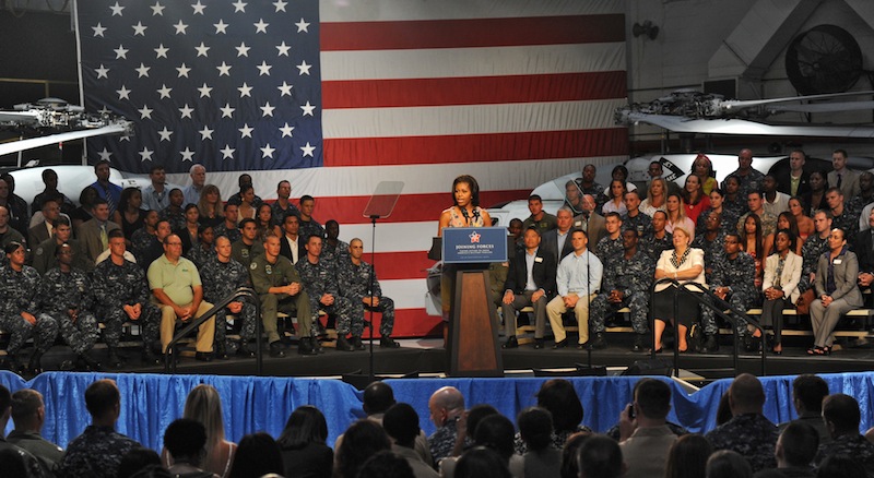 First Lady Michelle Obama visits the Mayport Naval Station in Jacksonville, Fla., Wednesday, Aug. 22, 2012. The first lady chose a naval station in the electoral battleground of Florida to announce that 2,000 businesses around the country have hired or trained more than 125,000 military veterans and spouses in the past year, exceeding a White House goal of 100,000 by the end of next year. (AP Photo/The Florida Times-Union, Bob Mack)