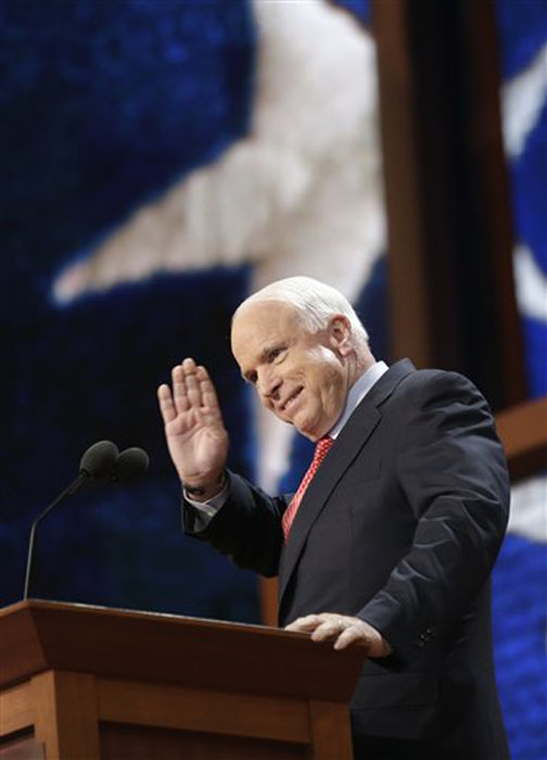 Arizona Senator John McCain gestures as he walks up to the podium during the Republican National Convention in Tampa, Fla., on Wednesday, Aug. 29, 2012. (AP Photo/Charles Dharapak)