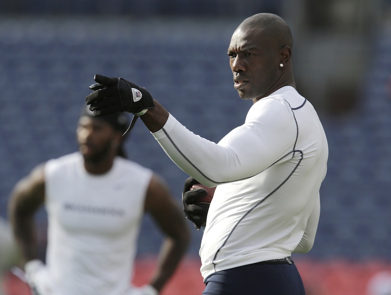 In this Aug. 18, 2012 file photo, Seattle Seahawks' Terrell Owens gestures during warm-ups before an NFL football preseason game against the Denver Broncos in Denver. Both Owens and San Francisco 49ers wide receiver Randy Moss are both determined to return to their dominating deep threats they were in their primes. (AP Photo/Joe Mahoney, file)