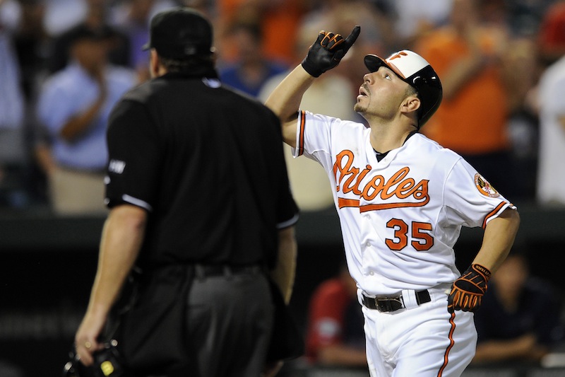 Baltimore Orioles' Omar Quintanilla (35) celebrates his home run against the Boston Red Sox during the third inning of a baseball game, Tuesday, Aug. 14, 2012, in Baltimore. (AP Photo/Nick Wass)