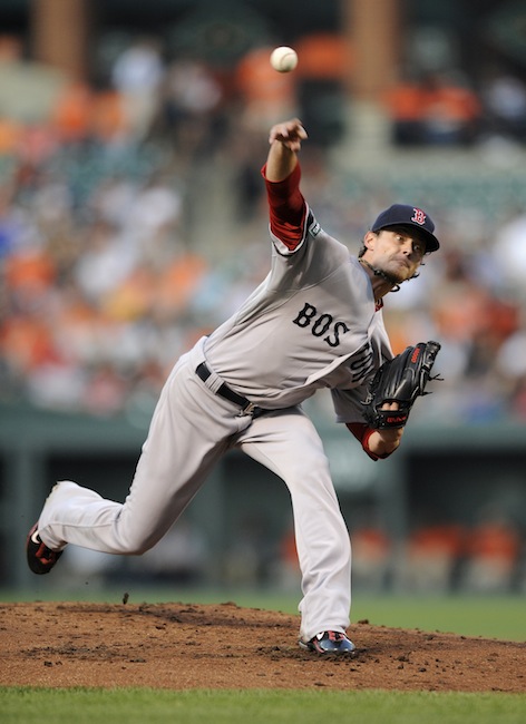 Boston Red Sox starting pitcher Clay Buchholz delivers against the Baltimore Orioles during the first inning of a baseball game on Thursday, Aug. 16, 2012, in Baltimore. (AP Photo/Nick Wass)
