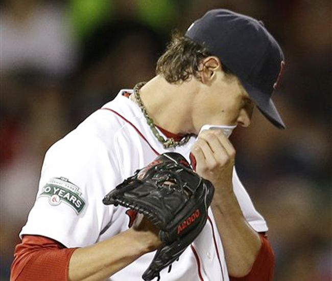 Boston Red Sox starting pitcher Clay Buchholz reacts after giving up a solo home run to Los Angeles Angels' Howard Kendrick during the sixth inning Wednesday.