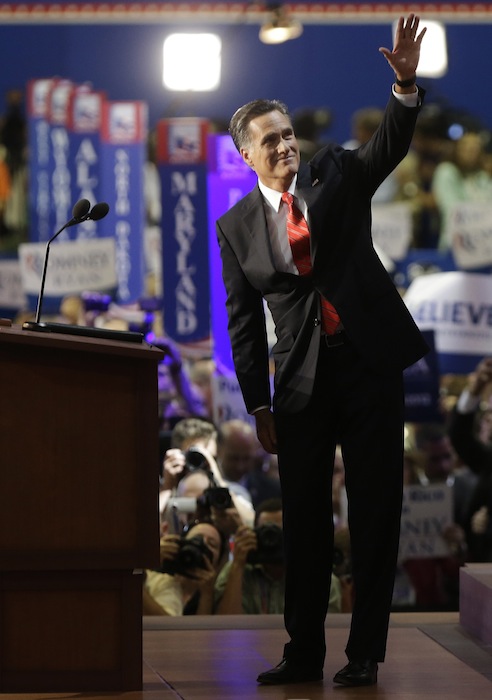 Republican presidential nominee Mitt Romney waves to delegates before speaking at the Republican National Convention in Tampa, Fla., on Thursday, Aug. 30, 2012. (AP Photo/Lynne Sladky)