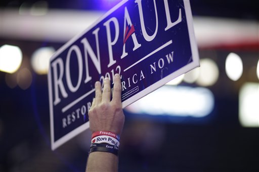 A Ron Paul supporter holds up a sign at the Republican National Convention on Monday.