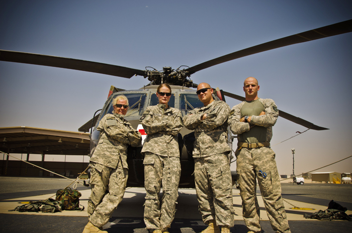 Staff Sgt. Jessica Wing is on the left in this photo of members of the126th Air Medevac Company, Maine Army National Guard, standing next to a UH-60 Blackhawk helicopter in the Middle East.