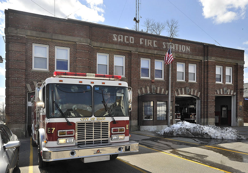 A Saco firefighter backs a truck into the Central Fire Station on the last day of its occupancy in 2011. The city council voted Monday, Aug. 20 to not sell the firehouse to a developer.