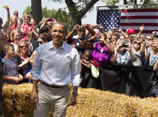 President Barack Obama attends a campaign event at the Nelson Pioneer Farm & Museum, Tuesday, Aug. 14, 2012, in Oskaloosa, Iowa, during a three day campaign bus tour through Iowa. (AP Photo/Carolyn Kaster)