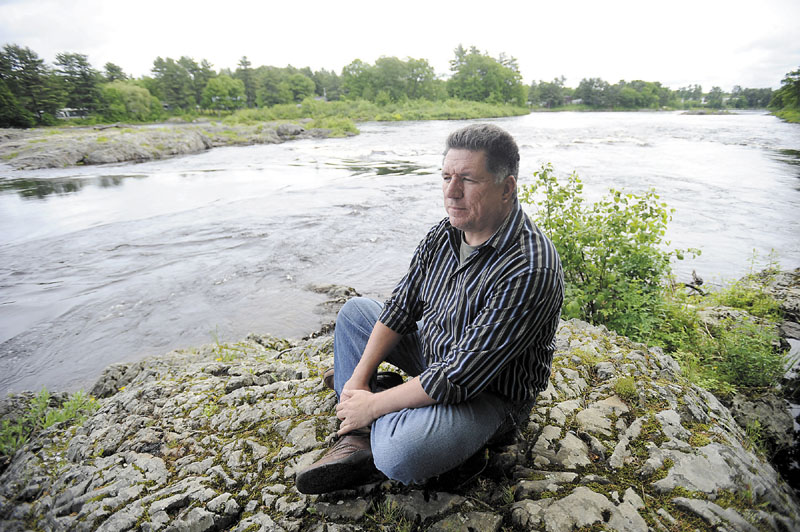 In this June 2012 file photo, James Eric Francis Sr., a tribal historian with the Penobscot Nation, looks over the Penobscot River from land on Indian Island.