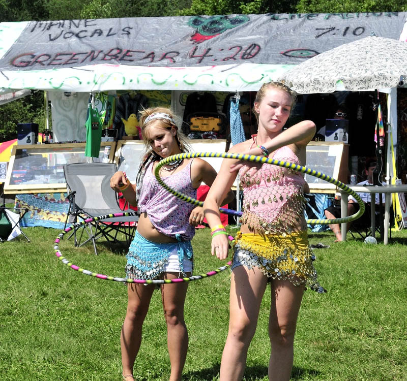 Kendall Emerton, left, and Jordan Rousse dance with hoops to live music during the Hempstock Fest in 2014.