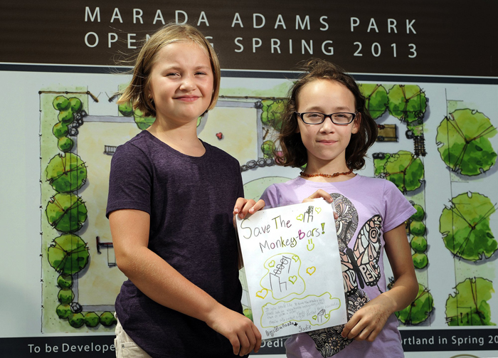 Sadie Ouillette, 9, left, and Natasha Malia, 10, are upset that monkey bars aren't in the plans for a new playground being built by the former Adams School.