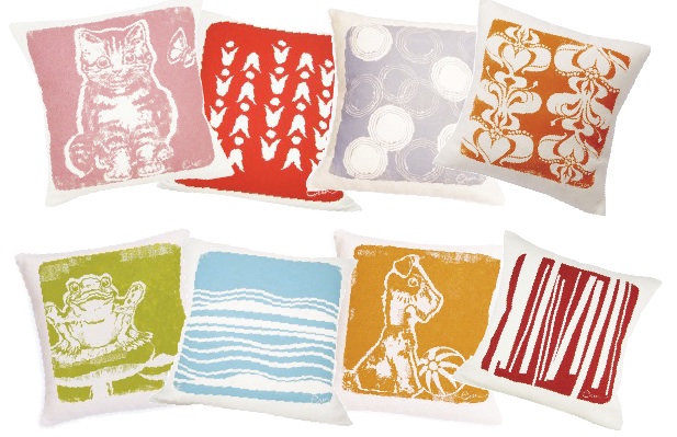 Some of Flett's pillows, top row, from left: “Gigi the Kitten,” “Mod Tulip,” “Coffee Rings” and “Stacked Deco”; bottom row from left: “Froggie,” “Wind,” “Bruiser the Pup” and “Logs.”
