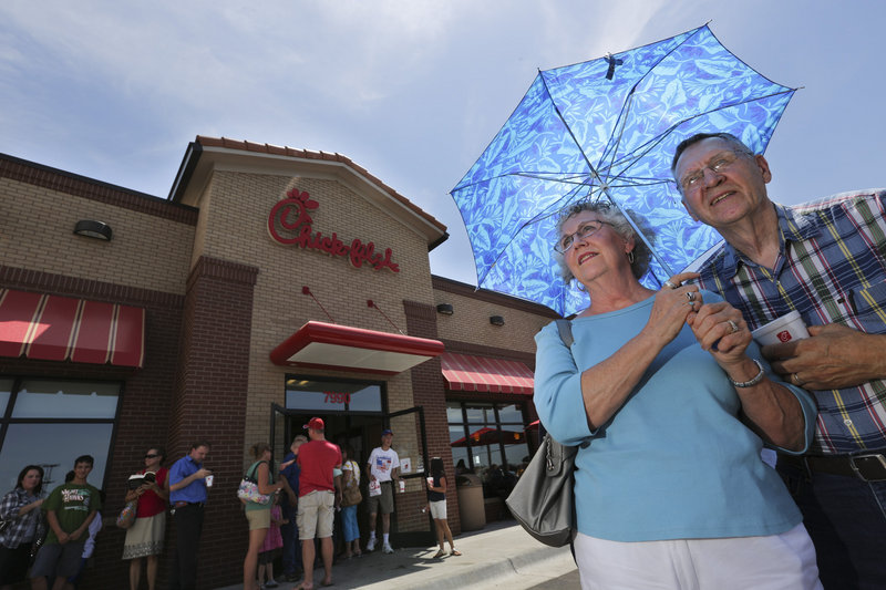 Brenda and Don Nichols wait in line at a Chick-fil-A in Wichita, Kan., on Wednesday. More than 200 people waited in line to buy a meal and show support for the company that’s embroiled in a controversy over same-sex marriage.