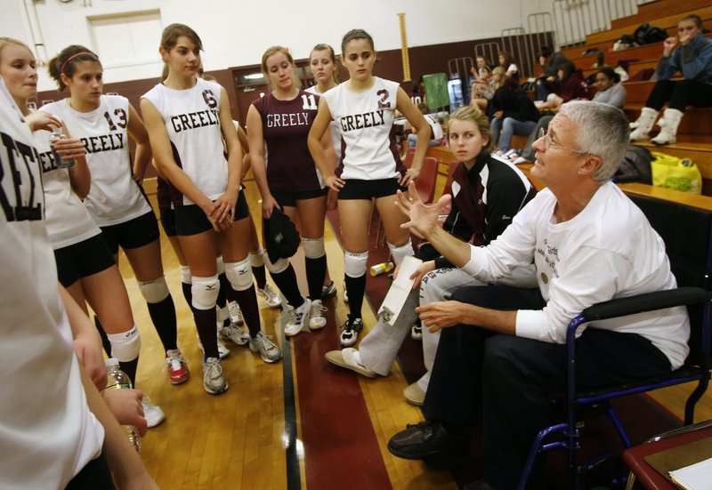 Churchill talks to the Greely High School volleyball team during a game in 2009. He coached for 11 seasons. Churchill, a popular obstetrician/gynecologist, died Monday.