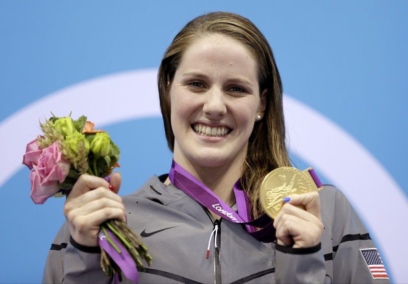 Missy Franklin claimed her third gold medal of the Olympics and broke the world record in the 200-meter backstroke.