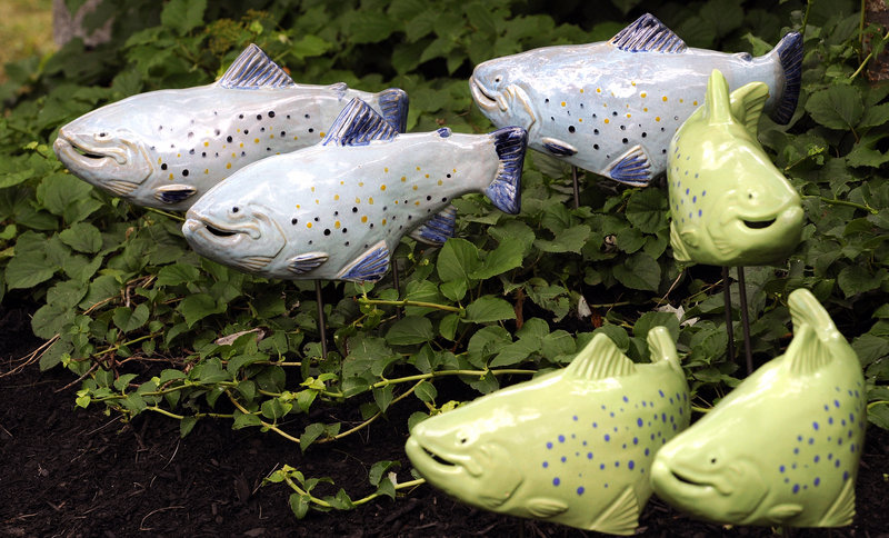 Troy Weiss makes his ceramic fish – salmon, trout, koi and other “celebrity fish” – in five or six popular colors.