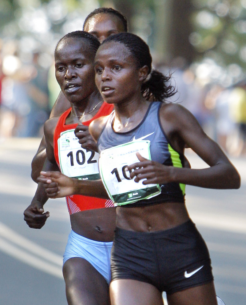 Margaret Wangari-Muriuki, right, clings to a tight lead over fellow Kenyans Lineth Chepkurui, left, and Rita Jeptoo during the Beach to Beacon 10K on Saturday in Cape Elizabeth. Wangari-Muriuki won the race with an official time of 31 minutes, 52 seconds, while Chepkurui finished third and Jeptoo fourth.