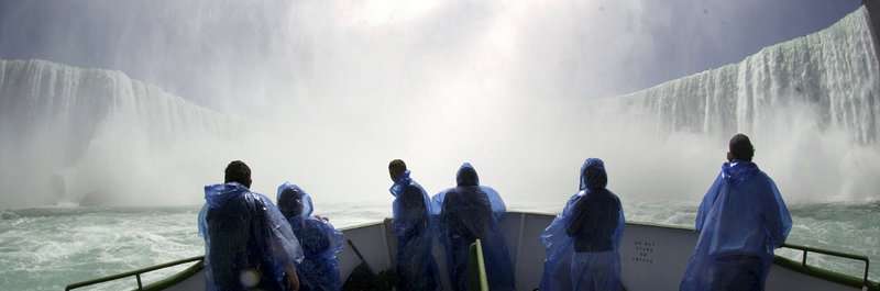 Tourists on the Maid of the Mist admire Horseshoe Falls. With its industrial base crumbling, the city of Niagara Falls is turning to tourism and other incentives to draw new residents and visitors and boost its struggling economy.