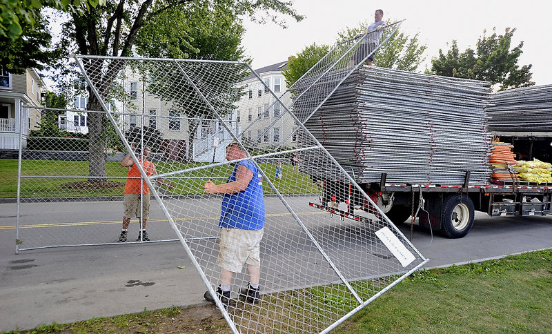 A crew from National Rent-A-Fence stacks for transport the last 1,300 feet of fencing used for Saturday’s Mumford & Sons concert on the Eastern Prom. The company, from Southborough, Mass., used 5,800 feet of fencing for the show.