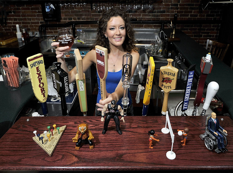 Bartender Nyla Smith draws an Ishmael American Copper Ale from Rising Tide Brewing Co. at the Thirsty Pig, which offers a good selection of Maine-made brews.