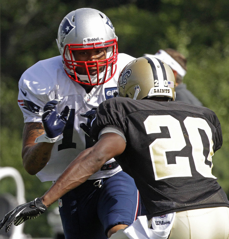 Jabar Gaffney of the Patriots works against Saints defensive back A.J. Davis during Tuesday’s practice at Foxborough, Mass. The teams play Thursday night.