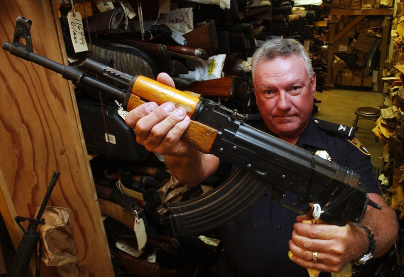 Police Chief John Wilson holds a confiscated semiautomatic weapon at the police station’s evidence room in Montgomery, Ala. An NRA solicitation letter warns that the re-election of President Obama could potentially lead to a “ban on semiautomatic weapons.”