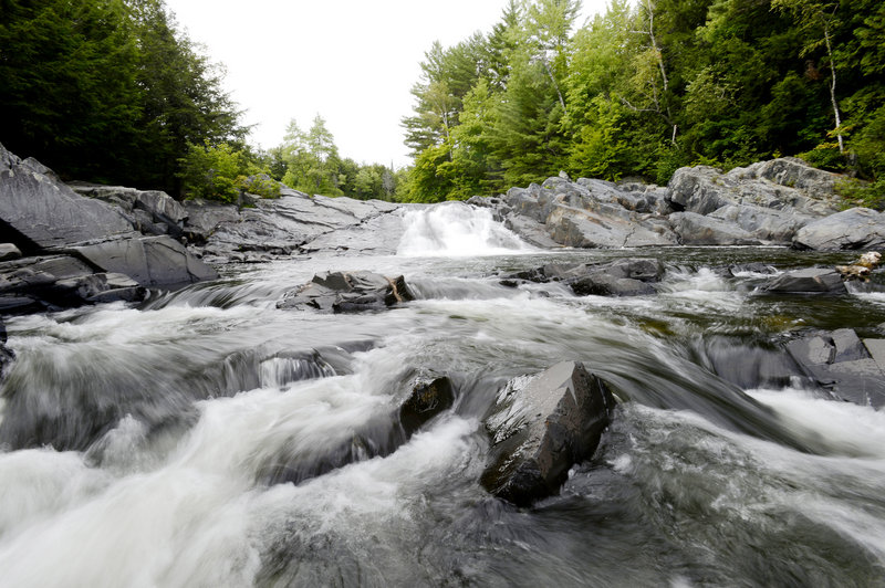 Water rushes over the rocks at Tobey’s Falls in Piscataquis County. Even during this hot Maine summer and in the midst of a national drought, the region’s waterfalls remain impressive.