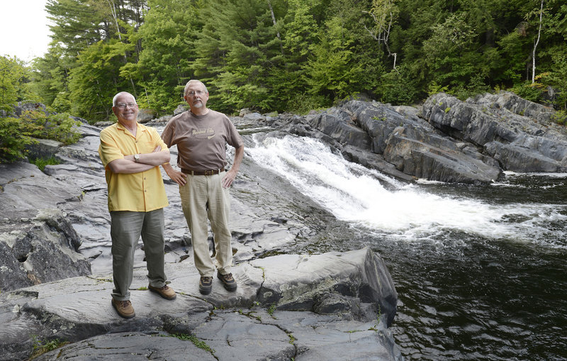 Kenneth Woodbury Jr., left, director of the Piscataquis Economic Council, and Bob Hamer, executive director of the Moosehead Lake Chamber of Commerce, show off Tobey’s Falls.