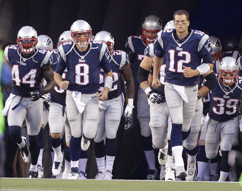 Tom Brady leads the charge of the Patriots as they take the field before their preseason game against the New Orleans Saints on Thursday night at Foxborough, Mass.