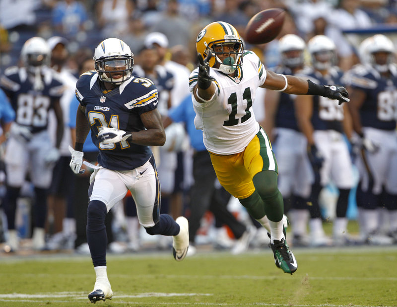 Jarrett Boykin of the Green Bay Packers stretches but can’t haul in a pass Thursday night while defended by Gregory Gatson of the San Diego Chargers during San Diego’s 21-13 win.