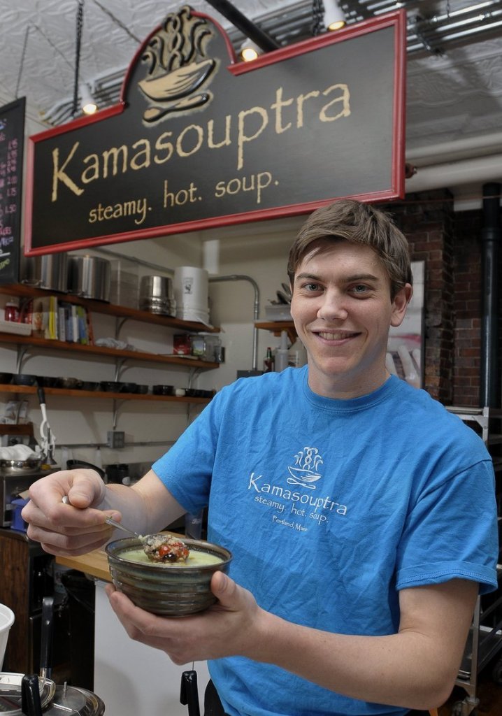 Drew Kinney, a co-owner at Kamasouptra in the Public Market House in Portland, displays one of the shop’s soup varieties.