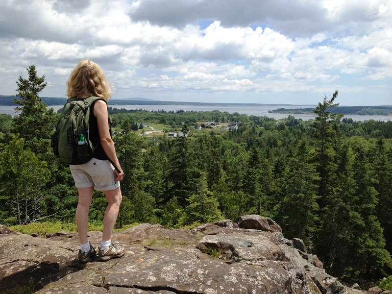 The summit at Pine Hill, part of Little Deer Isle, offers scenic views extending to Mount Desert Island and Isle au Haut.