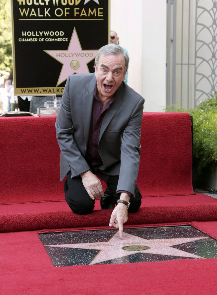 “I am,” he cried. Singer Neil Diamond attends a ceremony honoring him with a star on the Hollywood Walk of Fame on Friday in Hollywood. His career spans five decades.