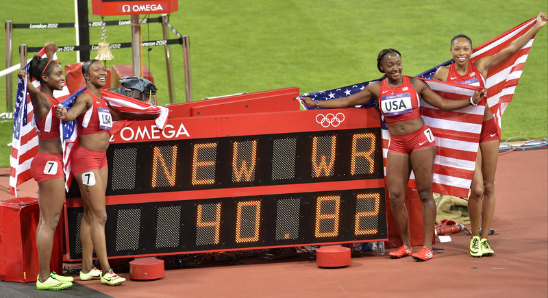 The United States 400 relay team earned its celebration Friday by setting a world record while winning the gold medal. From left are Tianna Madison, Carmelita Jeter, Bianca Knight and Allyson Felix.