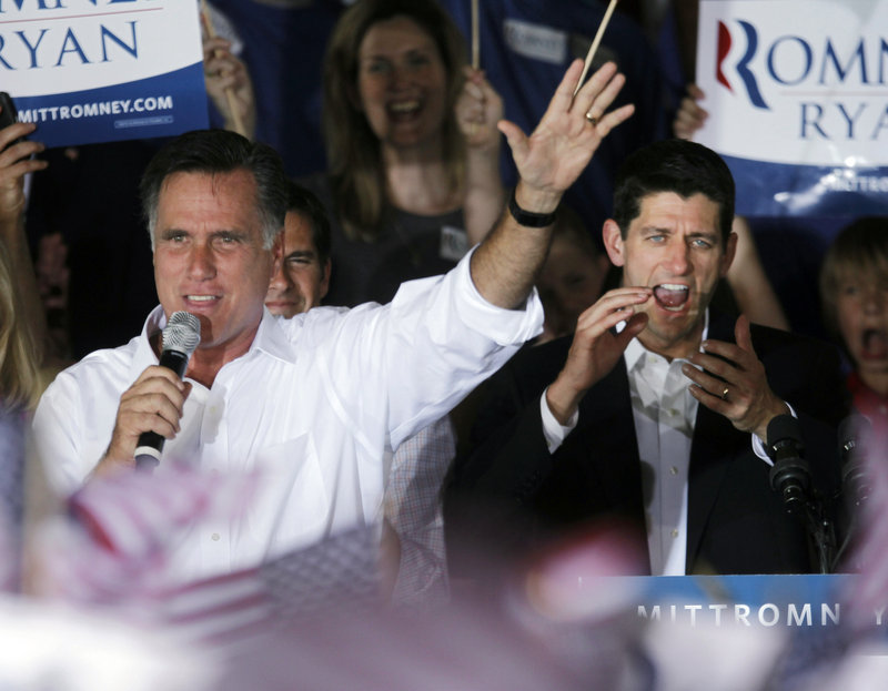 Republican presidential candidate former Massachusetts Gov. Mitt Romney, left, appears on stage with his newly announced vice-presidential running mate, U.S. Rep. Paul Ryan, R-Wis., during a campaign rally in Manassas, Va., on Saturday.