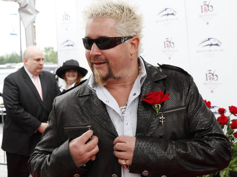 Guy Fieri, host of “Diners, Drive-ins and Dives,” is shown at the Kentucky Derby in 2010. Officials say at least two suspects tried to engineer the escape of a teen accused of stealing Fieri’s Lamborghini.