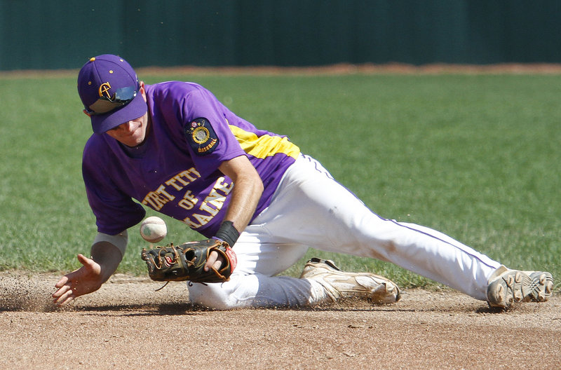 First Title second baseman Felix delVecchio knocks down a ground ball during his team’s 9-1 loss to Milford, Conn.