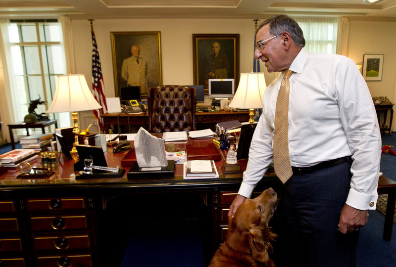 Defense Secretary Leon Panetta, with his golden retriever Bravo, speaks during an interview Monday at the Pentagon.