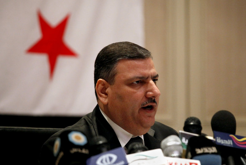 Riad Hijab, Syria’s former prime minister who defected, speaks at a news conference Tuesday in Amman, Jordan.
