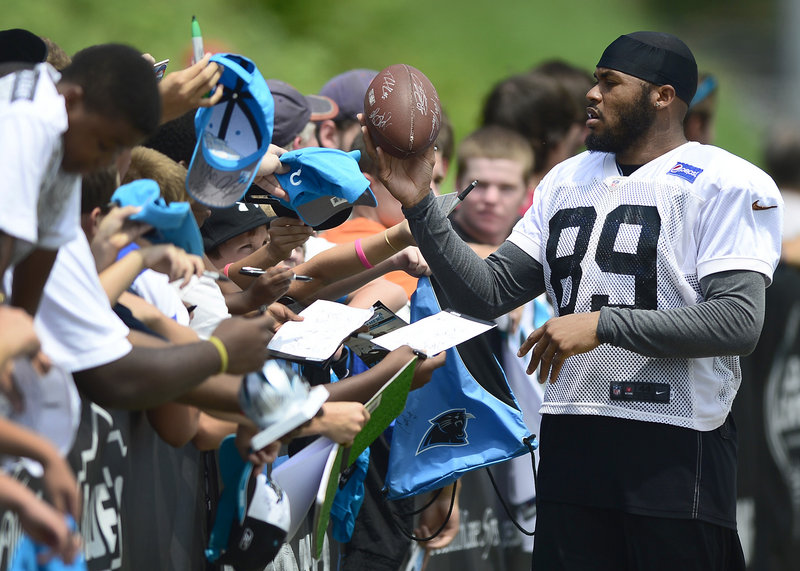 Carolina receiver Steve Smith signs autographs Wednesday following the team’s final training camp practice at Wofford College in Spartanburg, S.C. The team will continue to prepare for the season at its regular base in Charlotte, N.C.