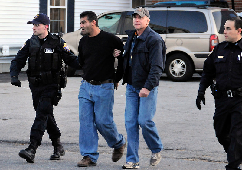 Scott Durst, in jacket, and Westbrook Police officers arrest Abbas Al-Hamdany on a drug charge in Westbrook. From left are Patrolman Steven Goldberg, Al-Hamdany, Durst and Patrolman Gus Rodriguez.