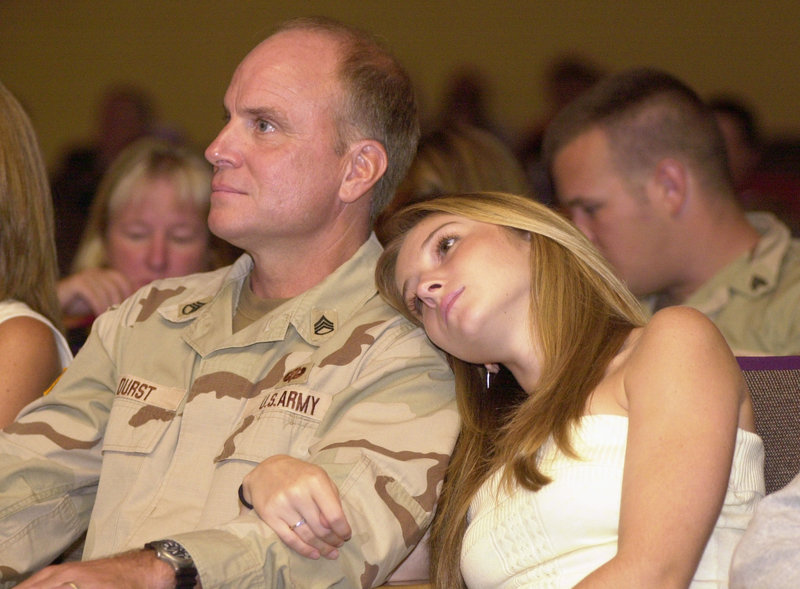 Staff Sgt. Scott Durst and his daughter, Devin, then 17, at his unit’s homecoming ceremony at Thornton Academy in Saco in 2004.