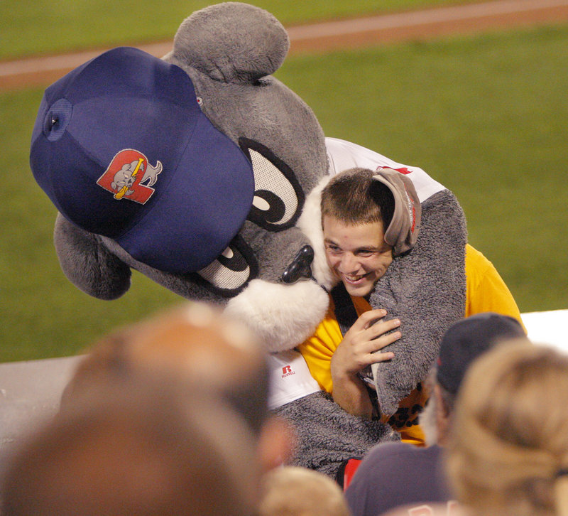 Slugger, the Sea Dogs mascot, mauls Stein during a game. “You don’t want to mess with Slugger,” Stein said. “He’ll steal your food.”