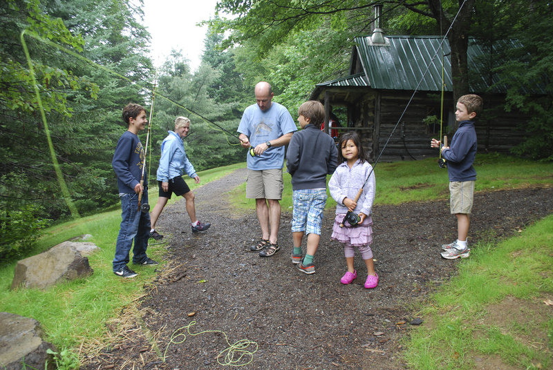 An assortment of fishermen gathers at Little Lyford Lodge for a fly fishing lesson. From left are Louk James of Amsterdam; Carrie Balderston of Bend, Ore., and her husband, Brent; Max James of Amsterdam; and Keira Paterson and Jake Butler of California.