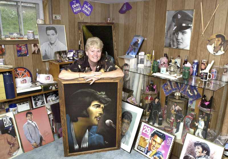 Dot Gonyea, shown here in the Elvis room of her South Portland home in 2004, is in Memphis this week to observe the 35th anniversary of the pop idol’s death. She spent two days and nights in line at the Civic Center to get tickets to his Portland show.