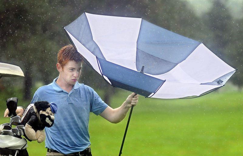 Joe Walp of the Falmouth Country Club had all the essentials for a day of Match Play Invitational golf Thursday: clubs and an umbrella. Walp made it to the semifinals.