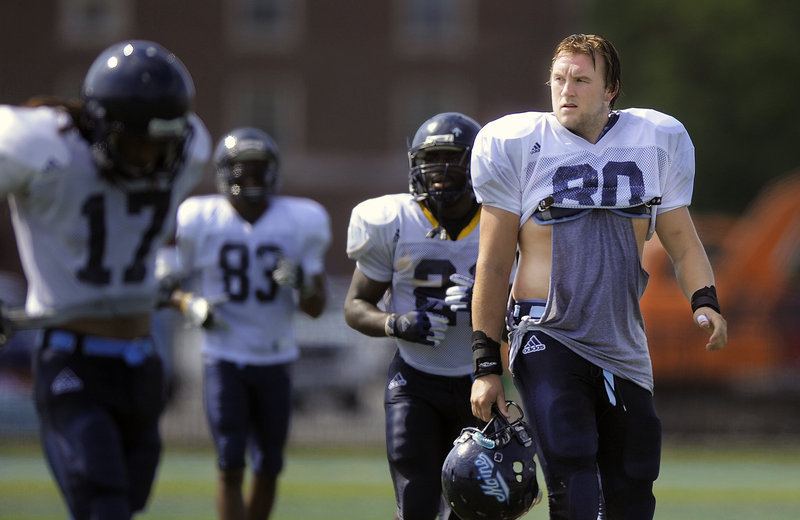 Justin Perillo, right, rose from third to first on the UMaine tight end depth chart last year and did such a bang-up job, he was named a preseason All-American this year.