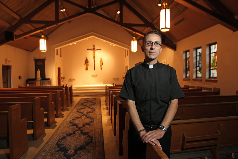 The Rev. Joseph Capella is shown in the sanctuary of the now-closed Our Lady of Grace church in Somerdale, N.J.